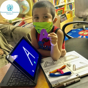 Child wearing a mask while participating in speech therapy