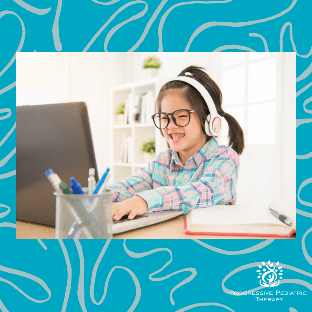 Child sitting at computer.