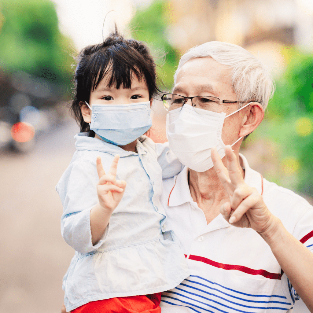 child and grandparent wearing mask