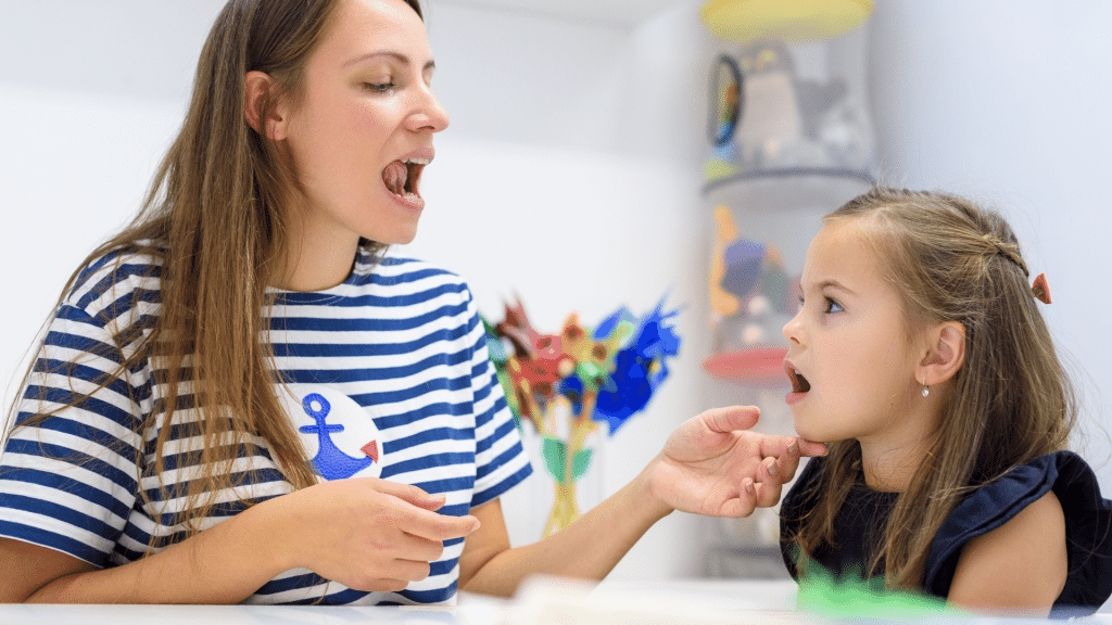 child with speech therapist