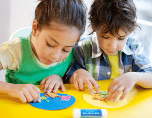 Two children making crafts