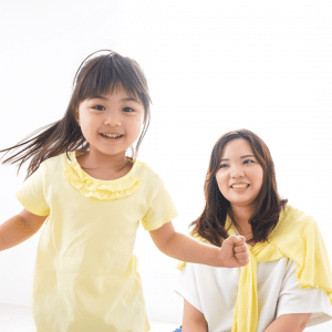 A mother and daughter play.