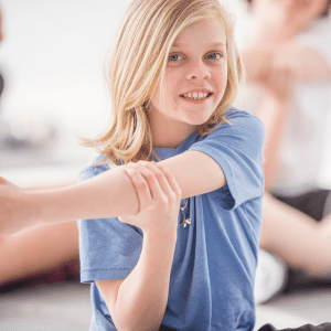 A boy stretches his arm