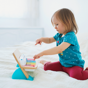 child playing on touch piano