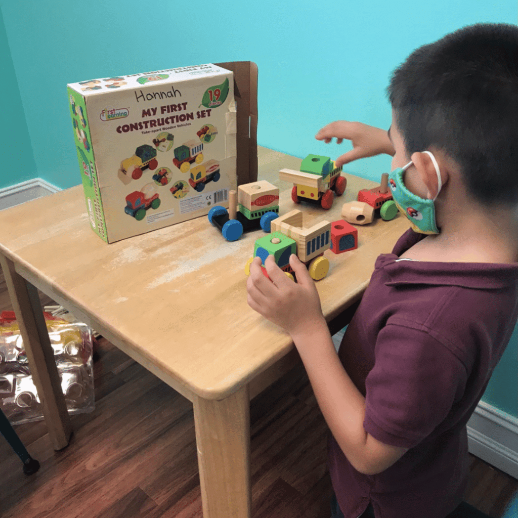 child playing with block toy